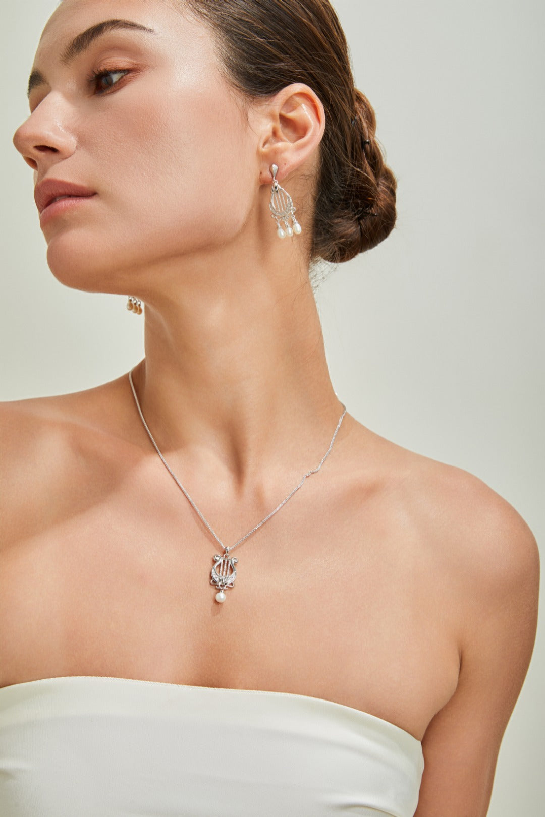Harp-shaped silver earrings